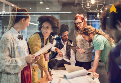 Image of five people working around a table - Nonprofit Website Best Practices blog featured image